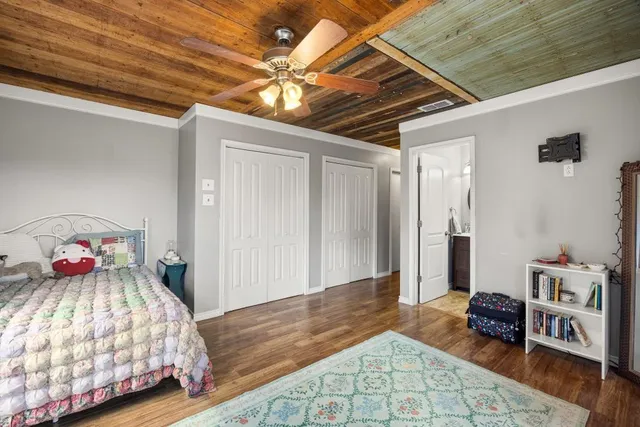 a bedroom with a bed and a dresser