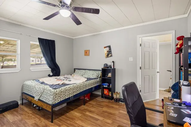 a bedroom with bed and a window