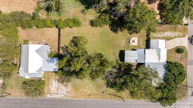 front view of a house with a trees