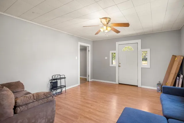 a view of livingroom with hardwood floor and ceiling fan