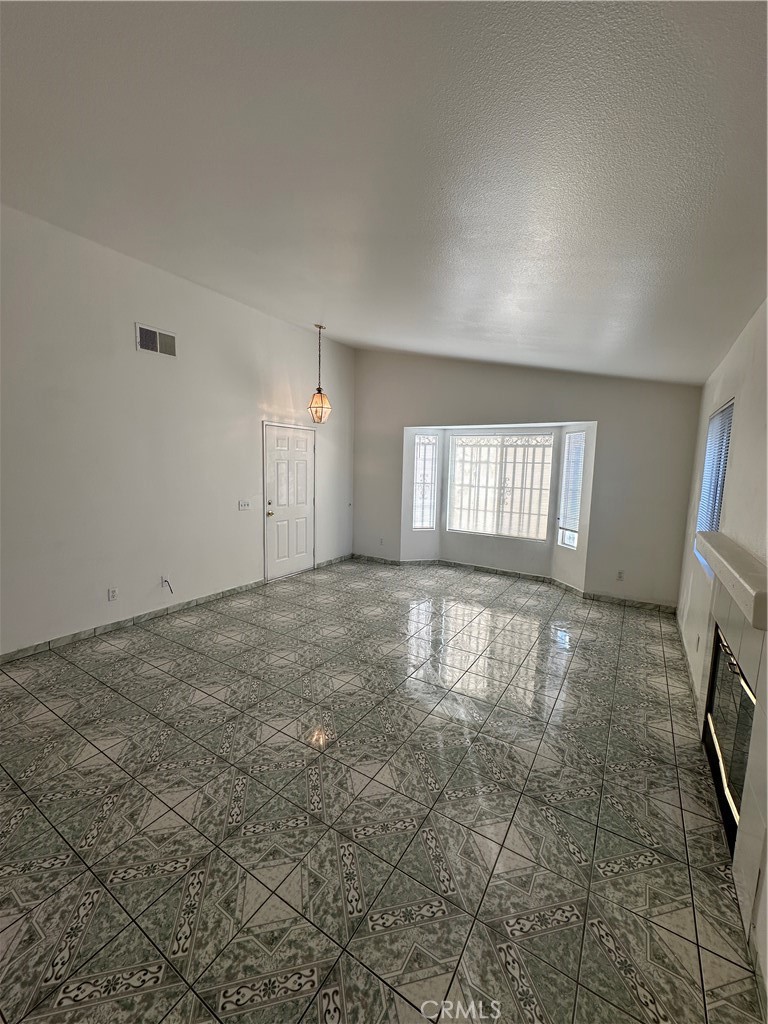 8505 Robinia Street Fontana, CA 92335 - Photo 22 of 30 a view of an empty room with a window