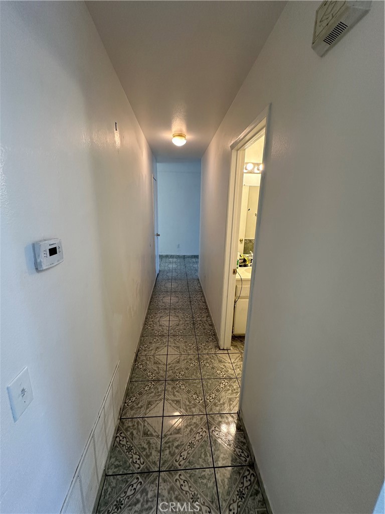 8505 Robinia Street Fontana, CA 92335 - Photo 25 of 30 a view of a hallway