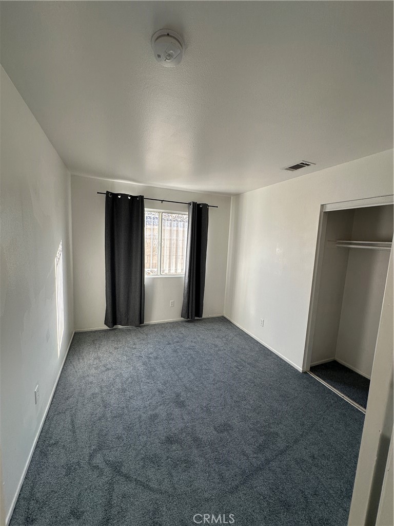 8505 Robinia Street Fontana, CA 92335 - Photo 9 of 30 a view of an empty room and window
