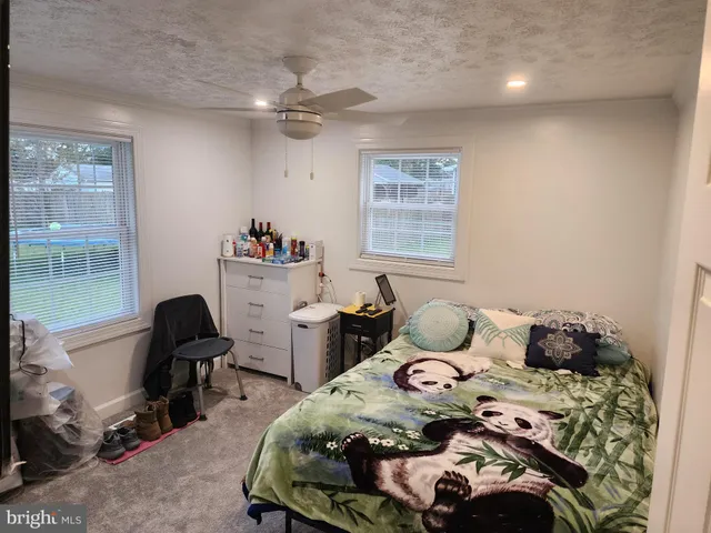 a bedroom with a bed and furniture