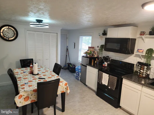a view of a dining room with furniture