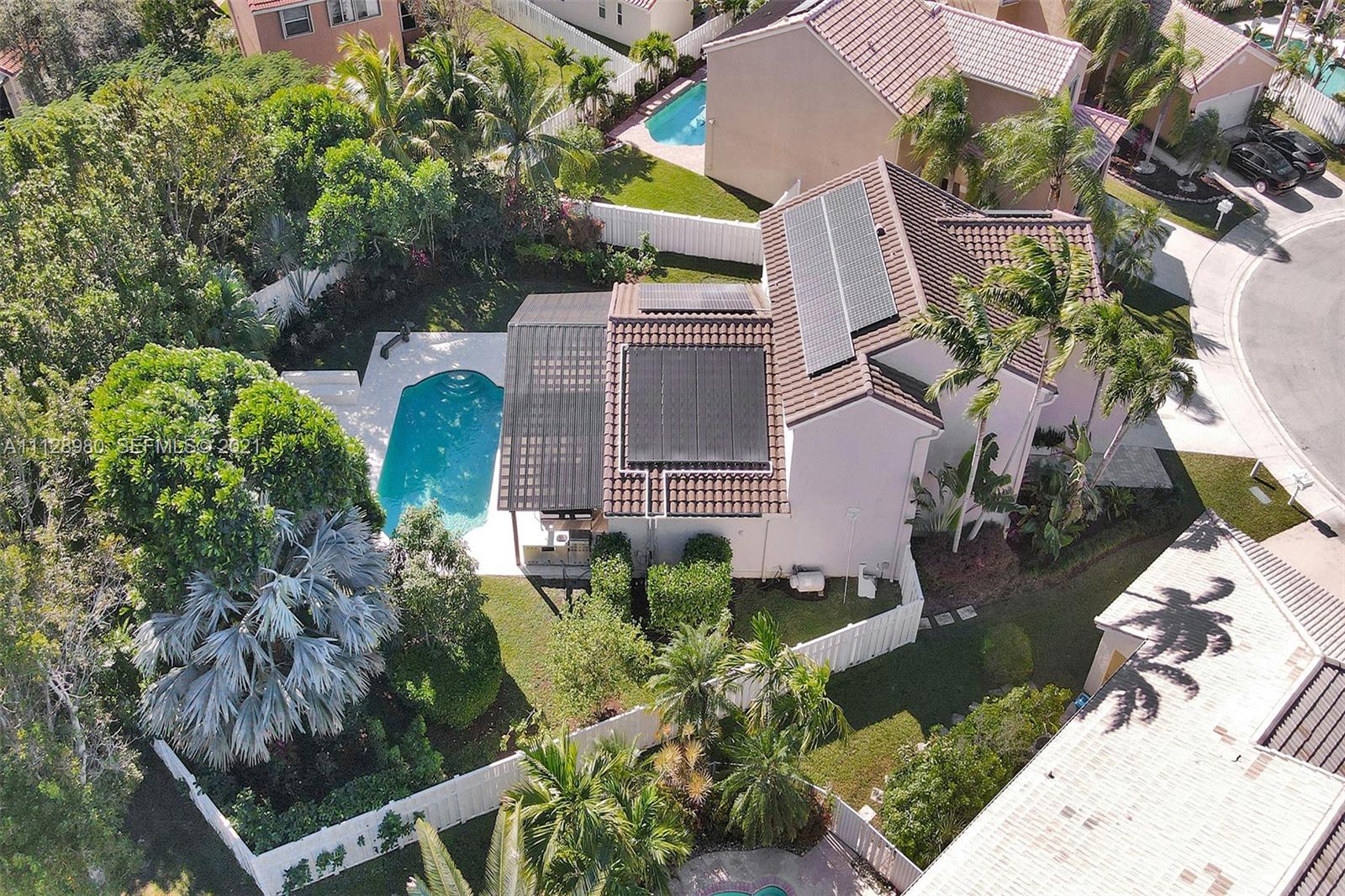 1078 Briar Ridge Road Weston, FL 33327 - Photo 36 of 41 an aerial view of a house with a yard and garden