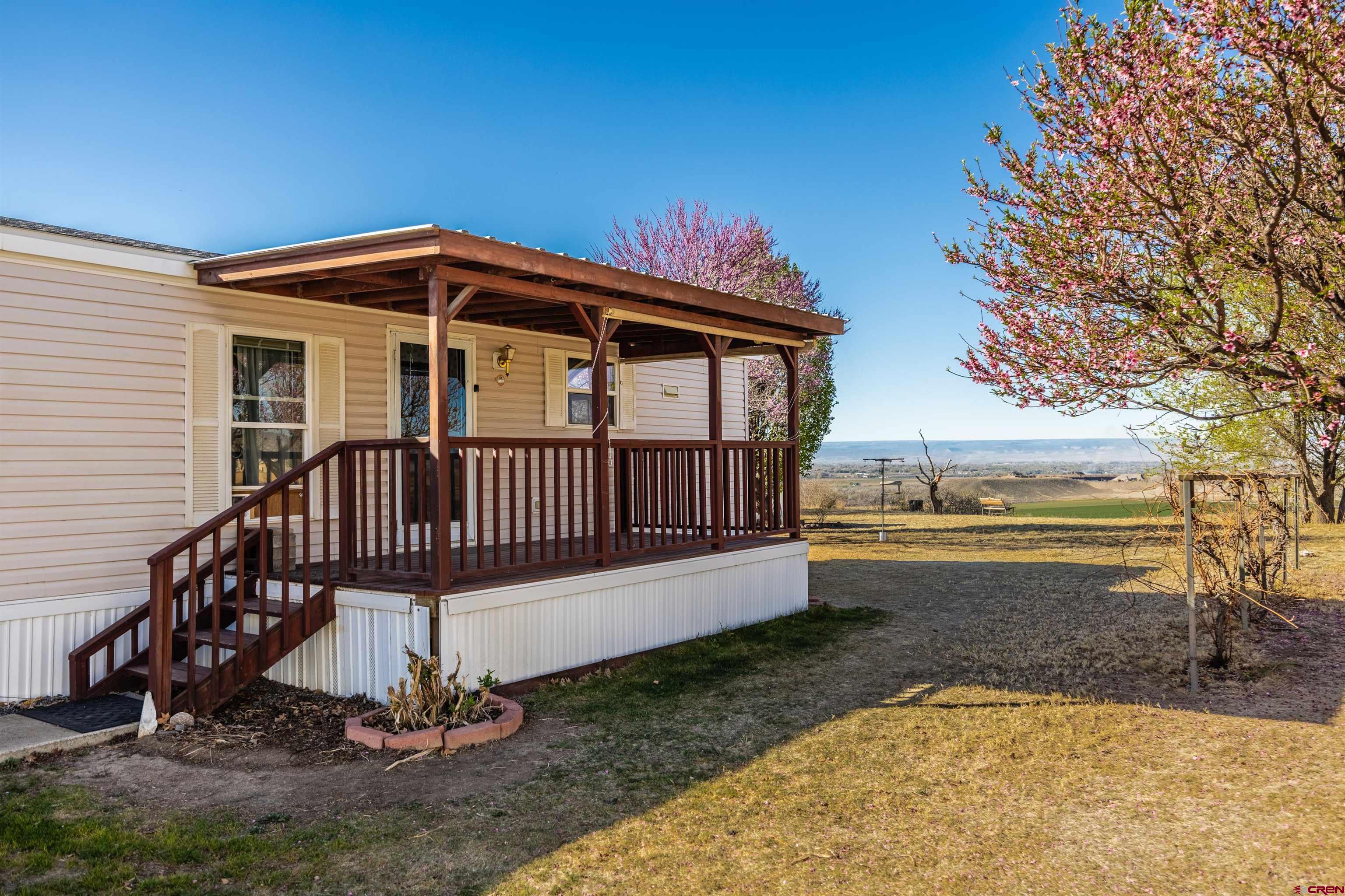 9713 Kebler Road, Unit 28 Austin, CO 81410 - Photo 1 of 25 a view of a house with a yard