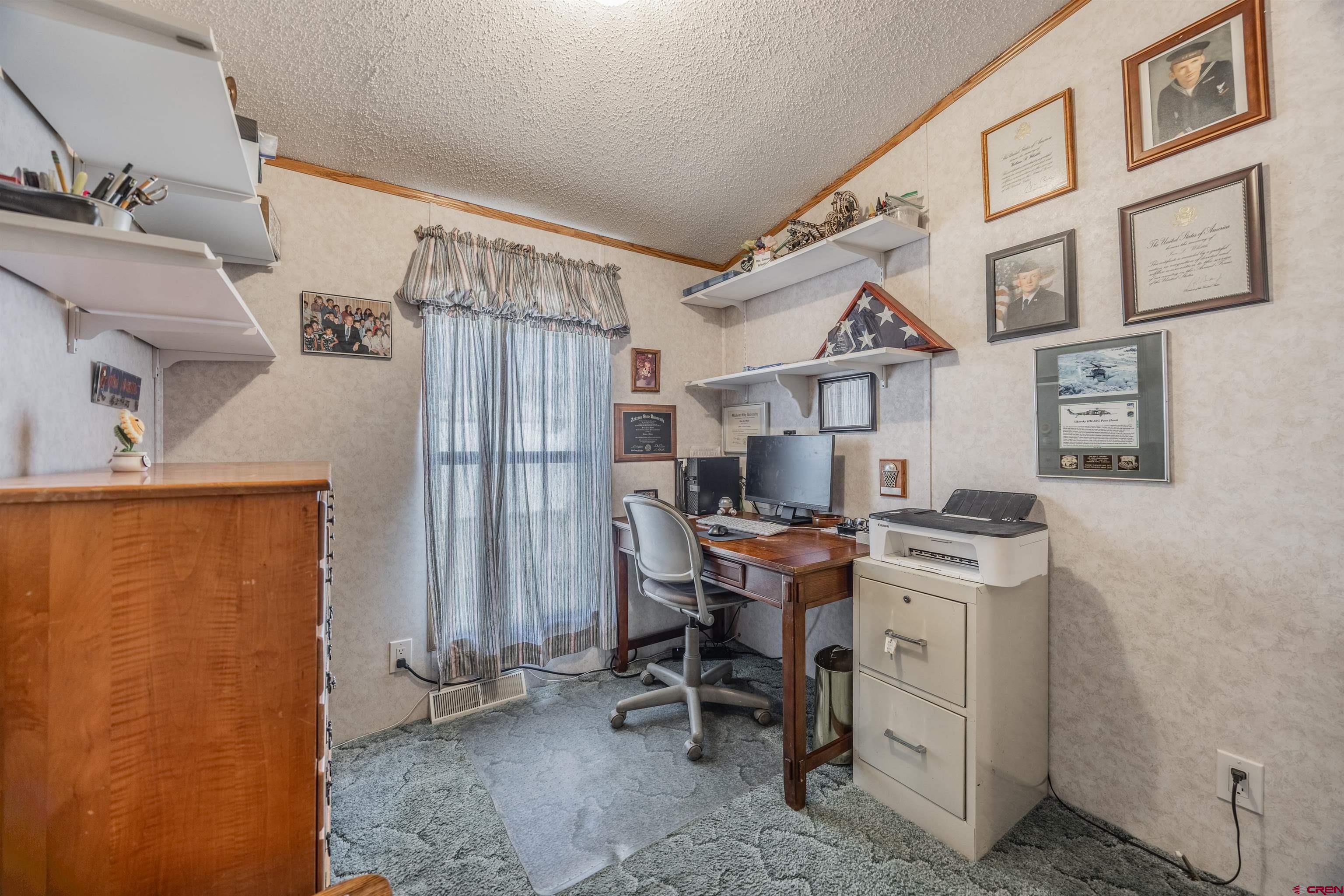 9713 Kebler Road, Unit 28 Austin, CO 81410 - Photo 11 of 25 a view of a livingroom with workspace and a window