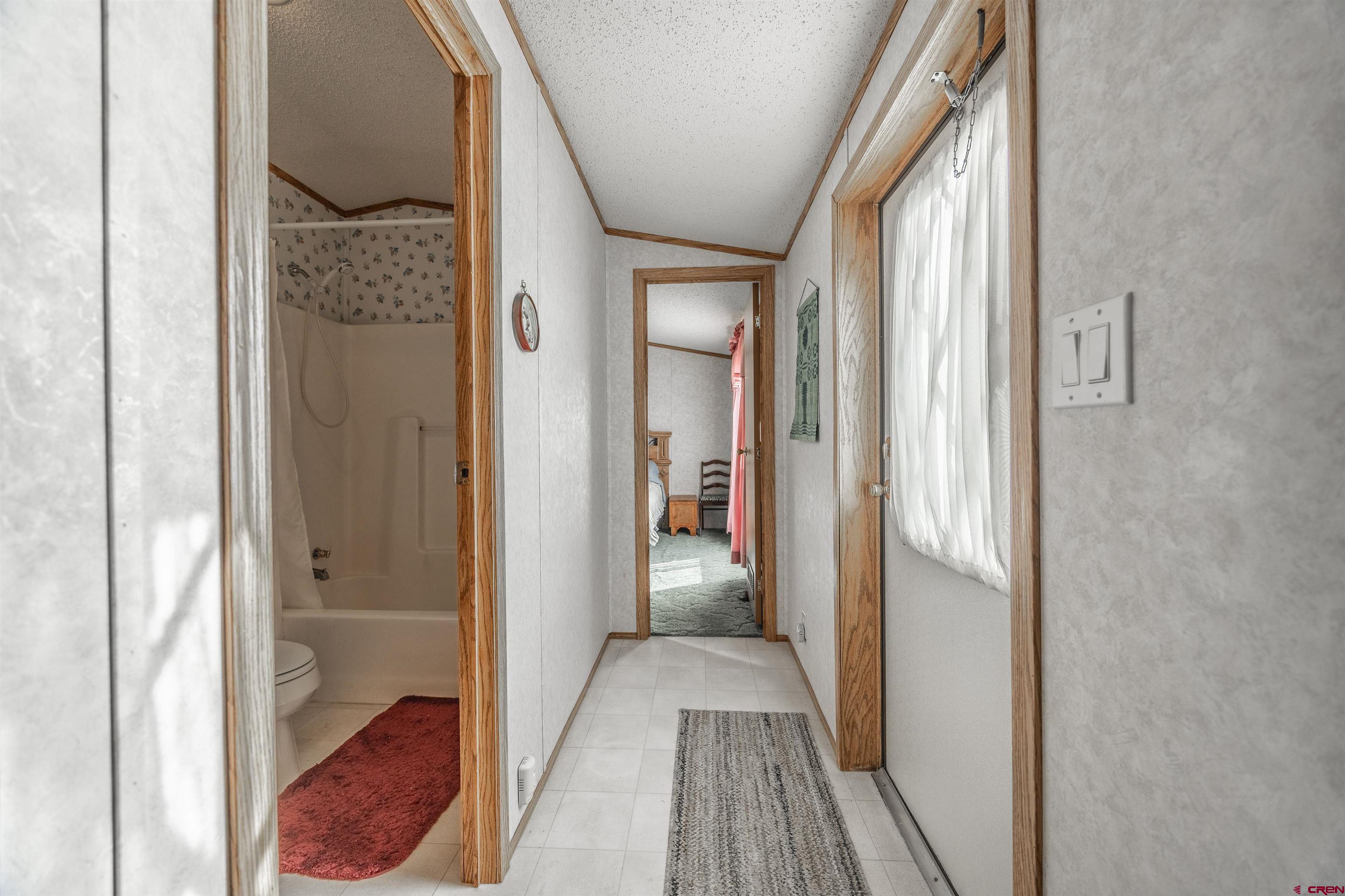 9713 Kebler Road, Unit 28 Austin, CO 81410 - Photo 15 of 25 a view of a bathroom from a hallway