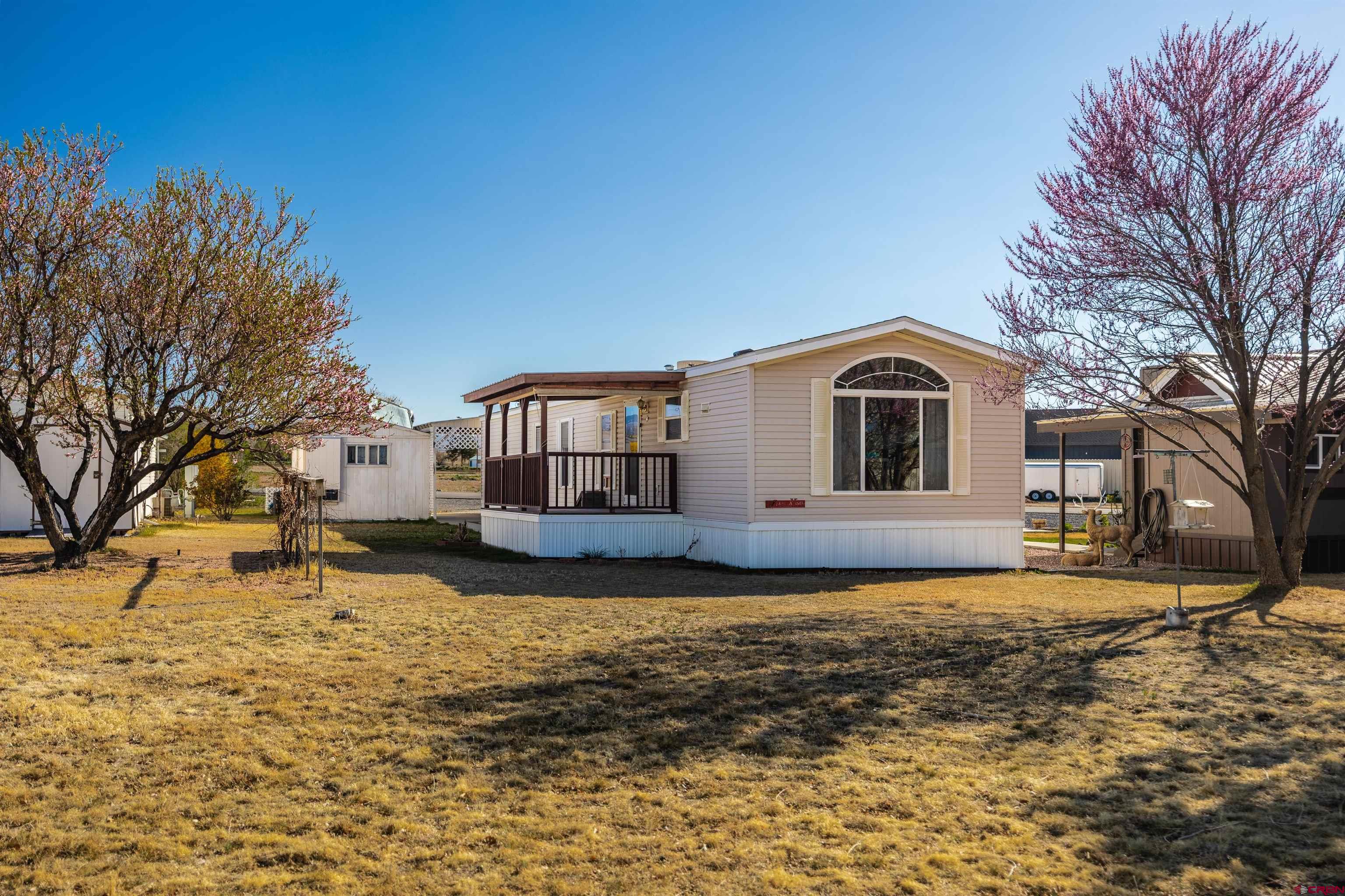 9713 Kebler Road, Unit 28 Austin, CO 81410 - Photo 20 of 25 a view of a house with a yard