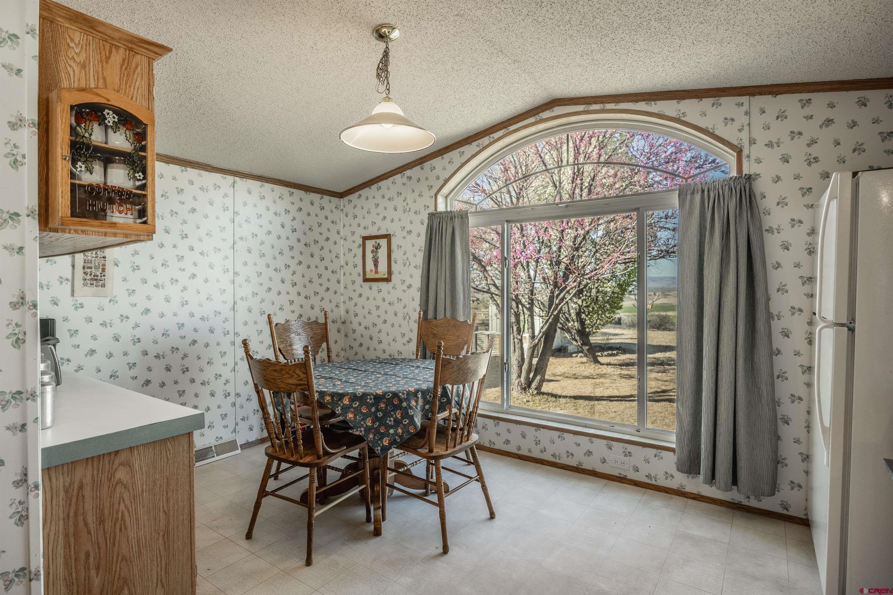 9713 Kebler Road, Unit 28 Austin, CO 81410 - Photo 5 of 25 a view of a dining room with furniture window and outside view