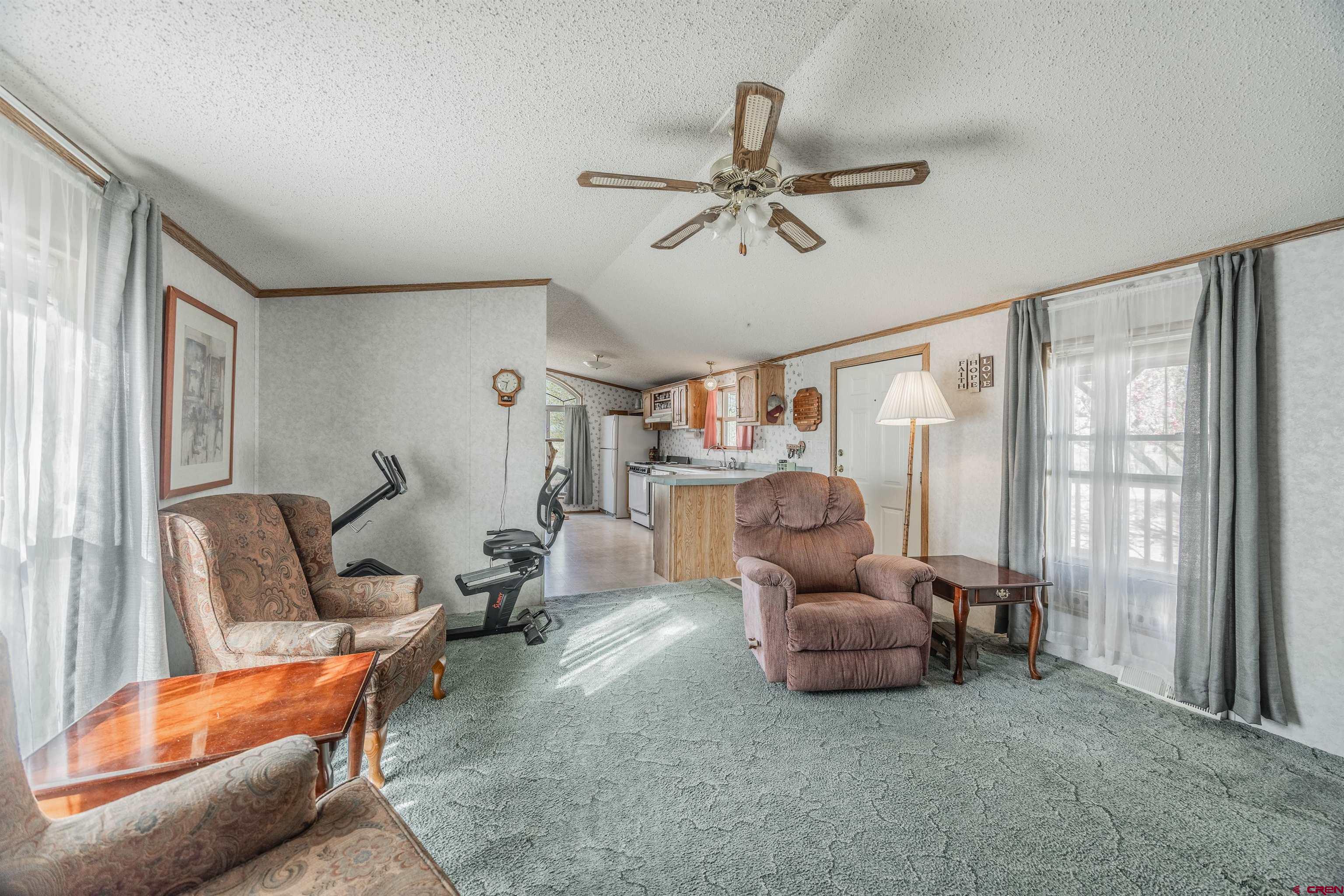9713 Kebler Road, Unit 28 Austin, CO 81410 - Photo 9 of 25 a living room with furniture and a large window