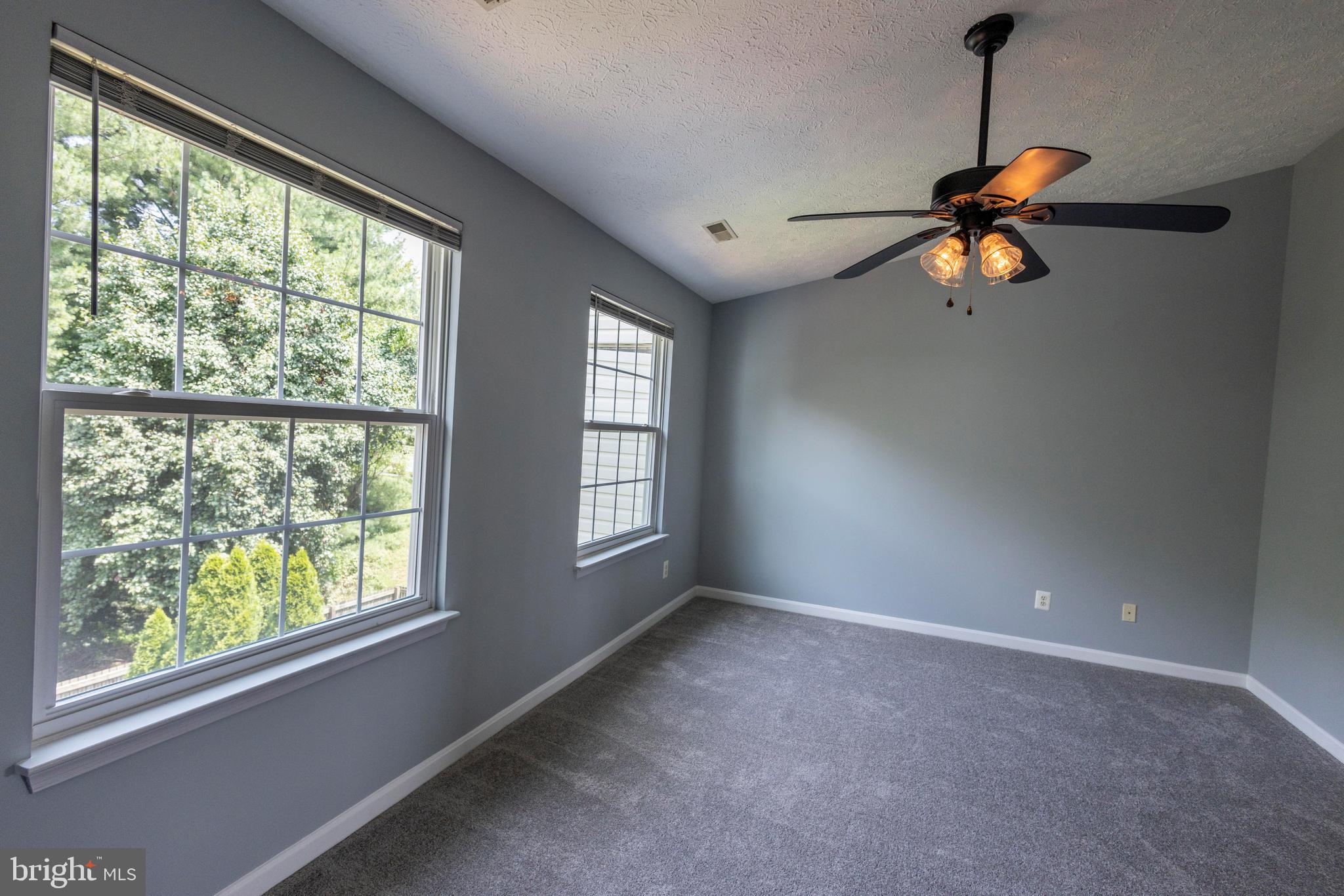 502 Buckstone Garth Abingdon, MD 21009 - Photo 11 of 36 a view of wooden floor and a chandelier fan in a room