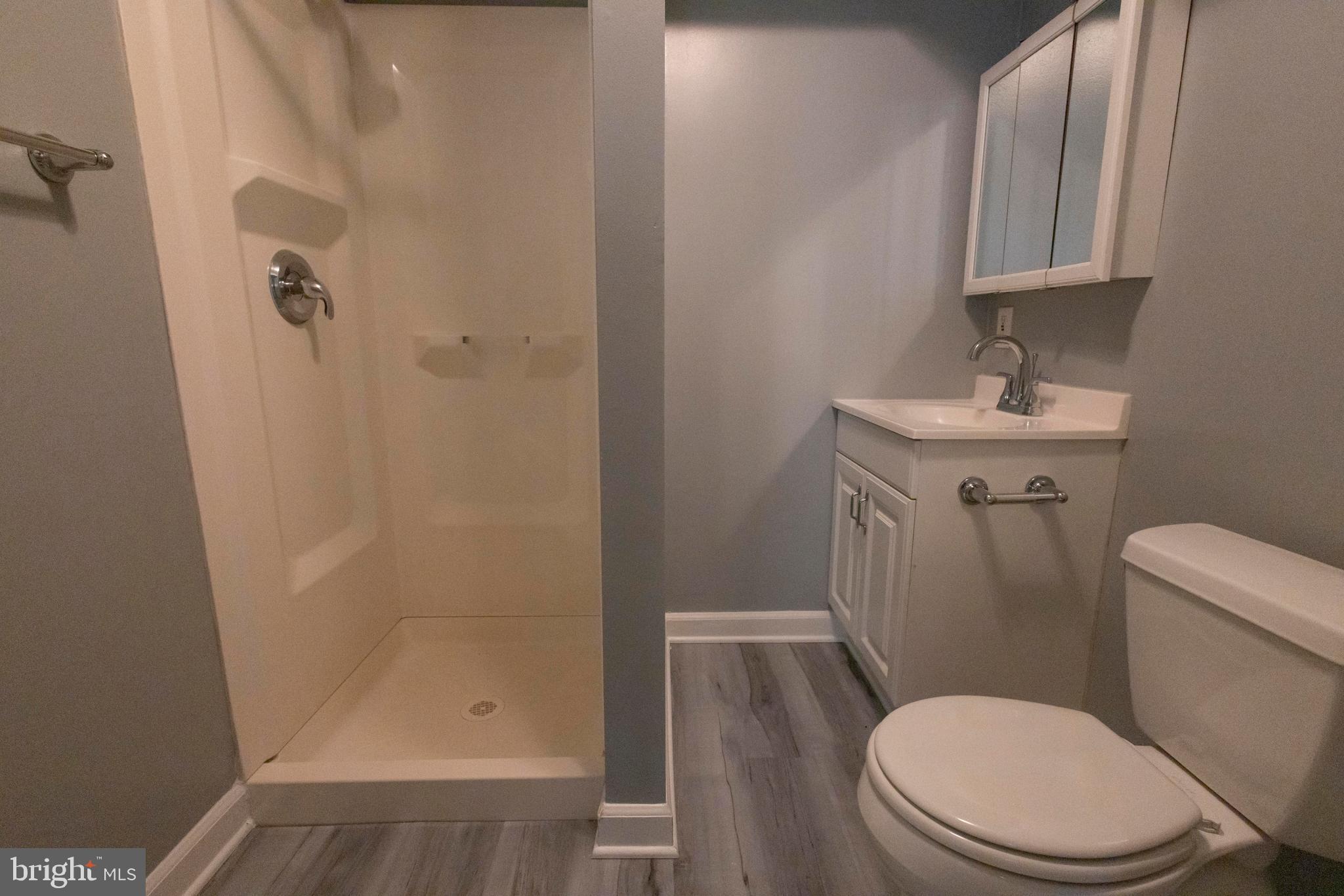 502 Buckstone Garth Abingdon, MD 21009 - Photo 21 of 36 a white toilet sitting next to a bathroom sink