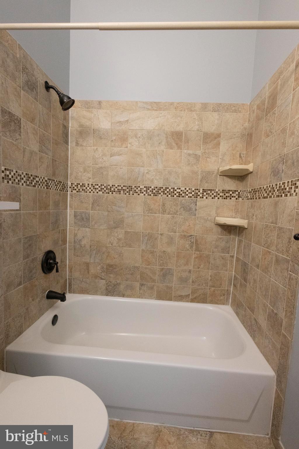 502 Buckstone Garth Abingdon, MD 21009 - Photo 6 of 36 a bathroom with a bathtub and a shower