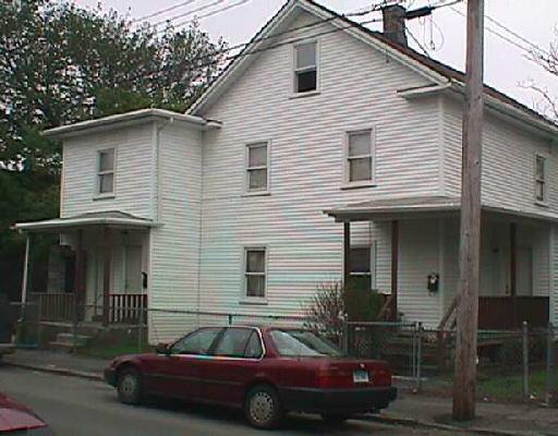 70 Deforest Avenue Bridgeport, CT 06607 - Photo 1 of 1 a front view of a house with parking space