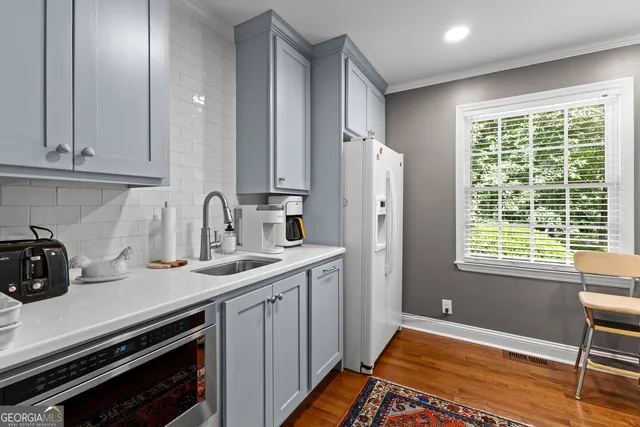 a bathroom with a shower and a sink