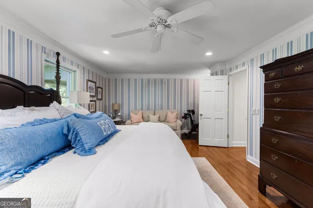 a front view of a house with a garden and yard