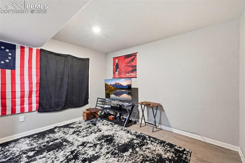 6186 Pilgrimage Road Colorado Springs, CO 80925 - Photo 13 of 20 a workspace with furniture and a window