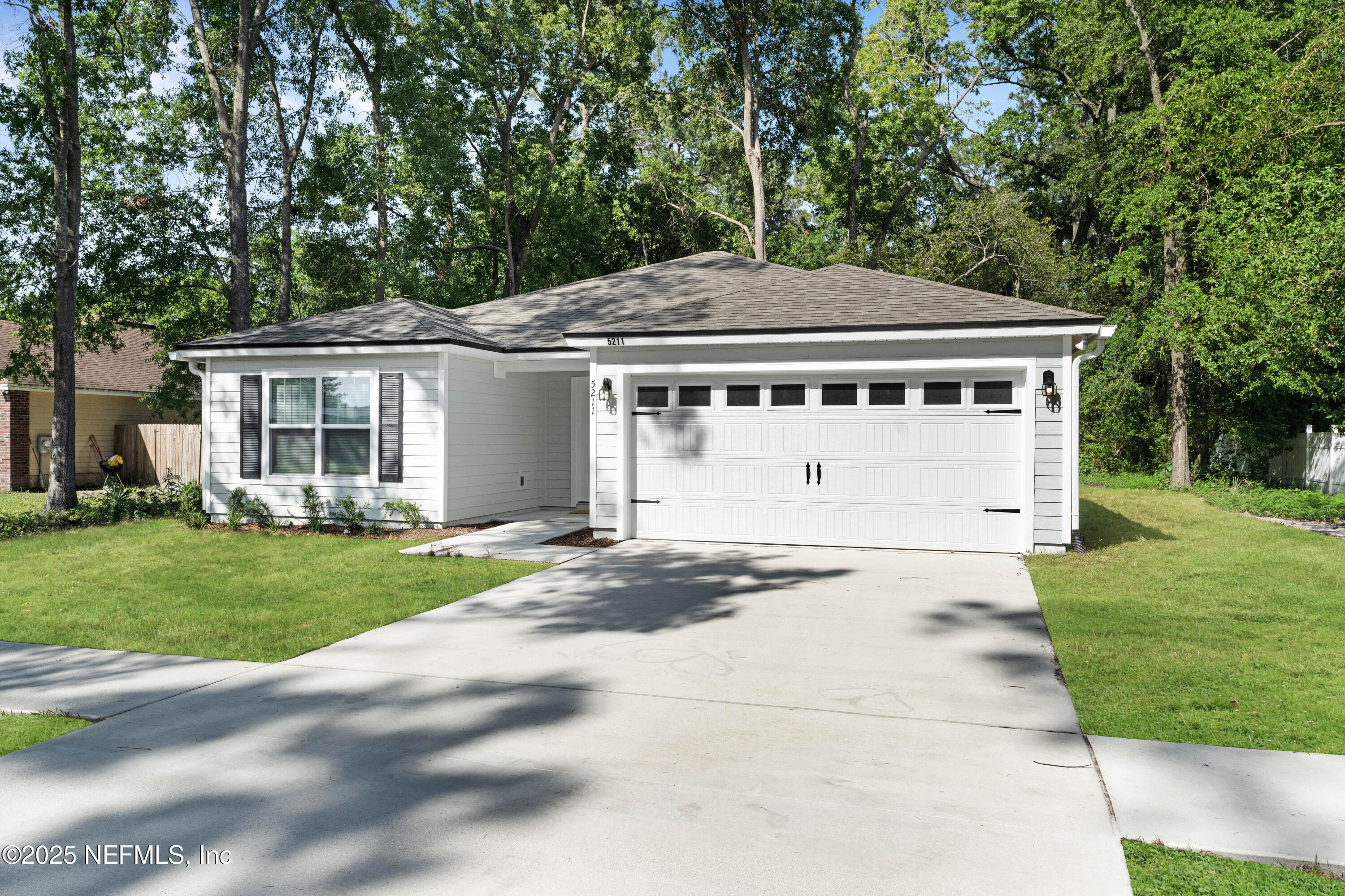 5211 Vernon Road Jacksonville, FL 32209 - Photo 1 of 27 front view of a house with a yard