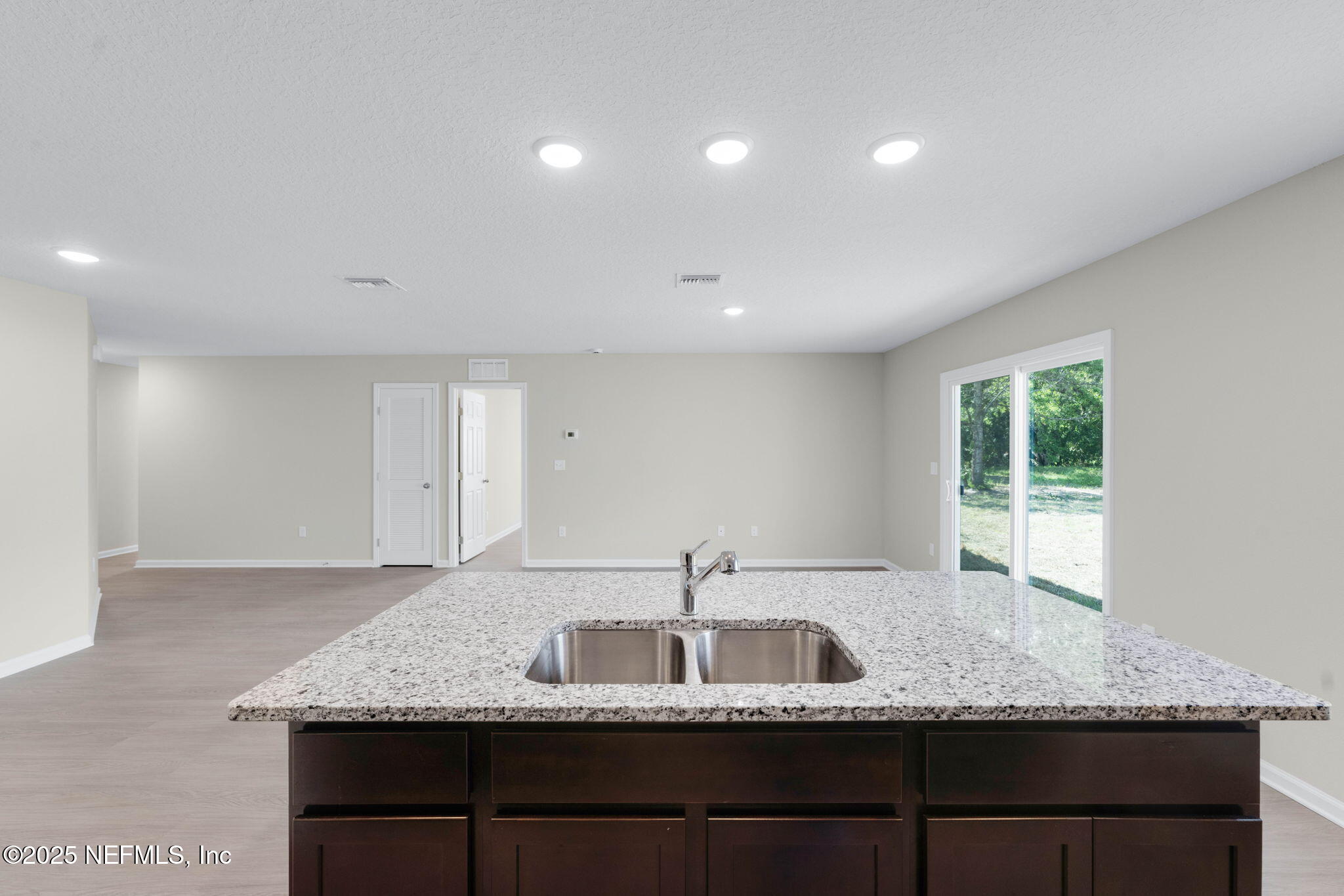 5211 Vernon Road Jacksonville, FL 32209 - Photo 11 of 27 a kitchen with granite countertop a sink and a window