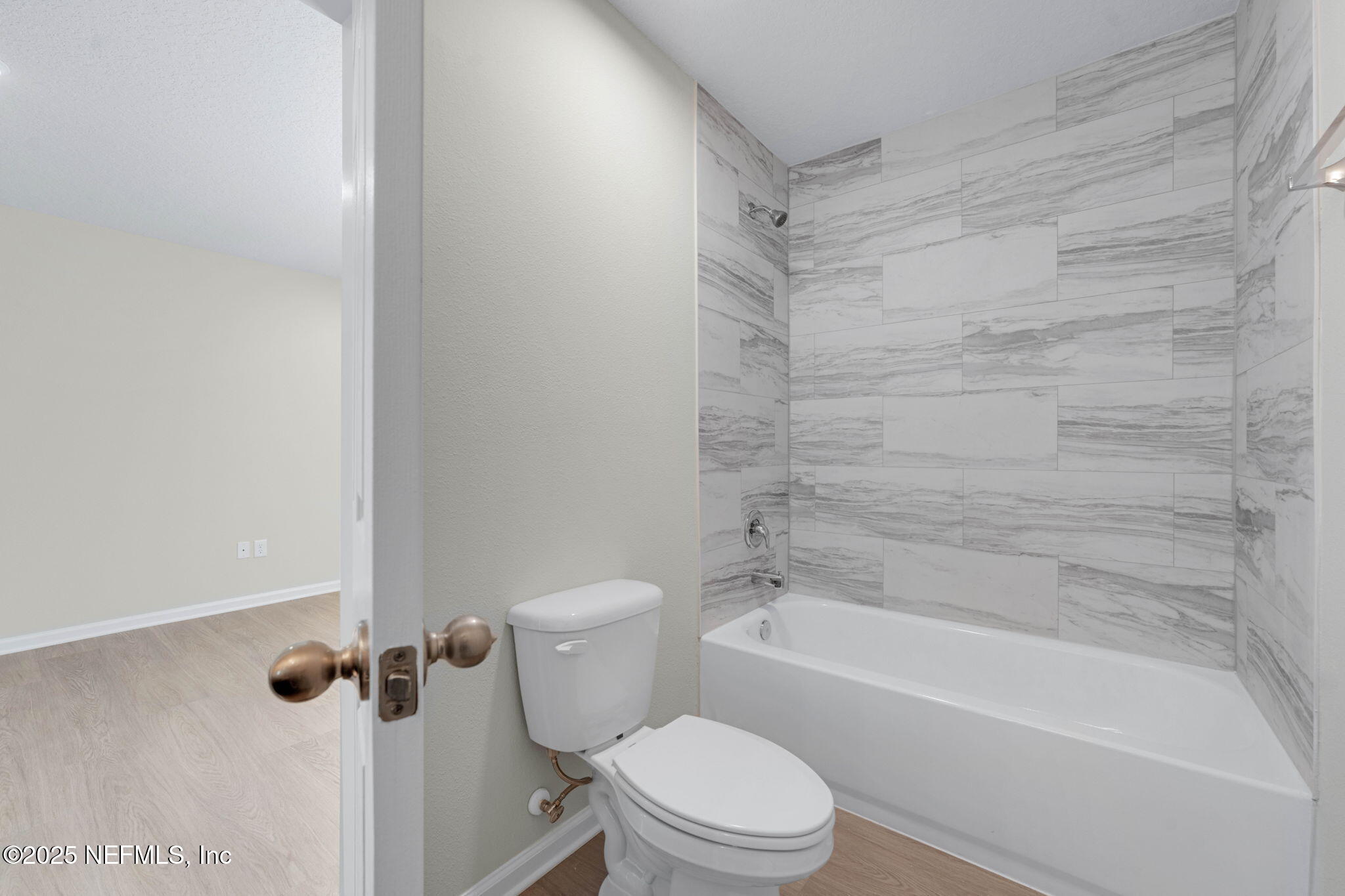 5211 Vernon Road Jacksonville, FL 32209 - Photo 18 of 27 a bathroom with a toilet and a bathtub