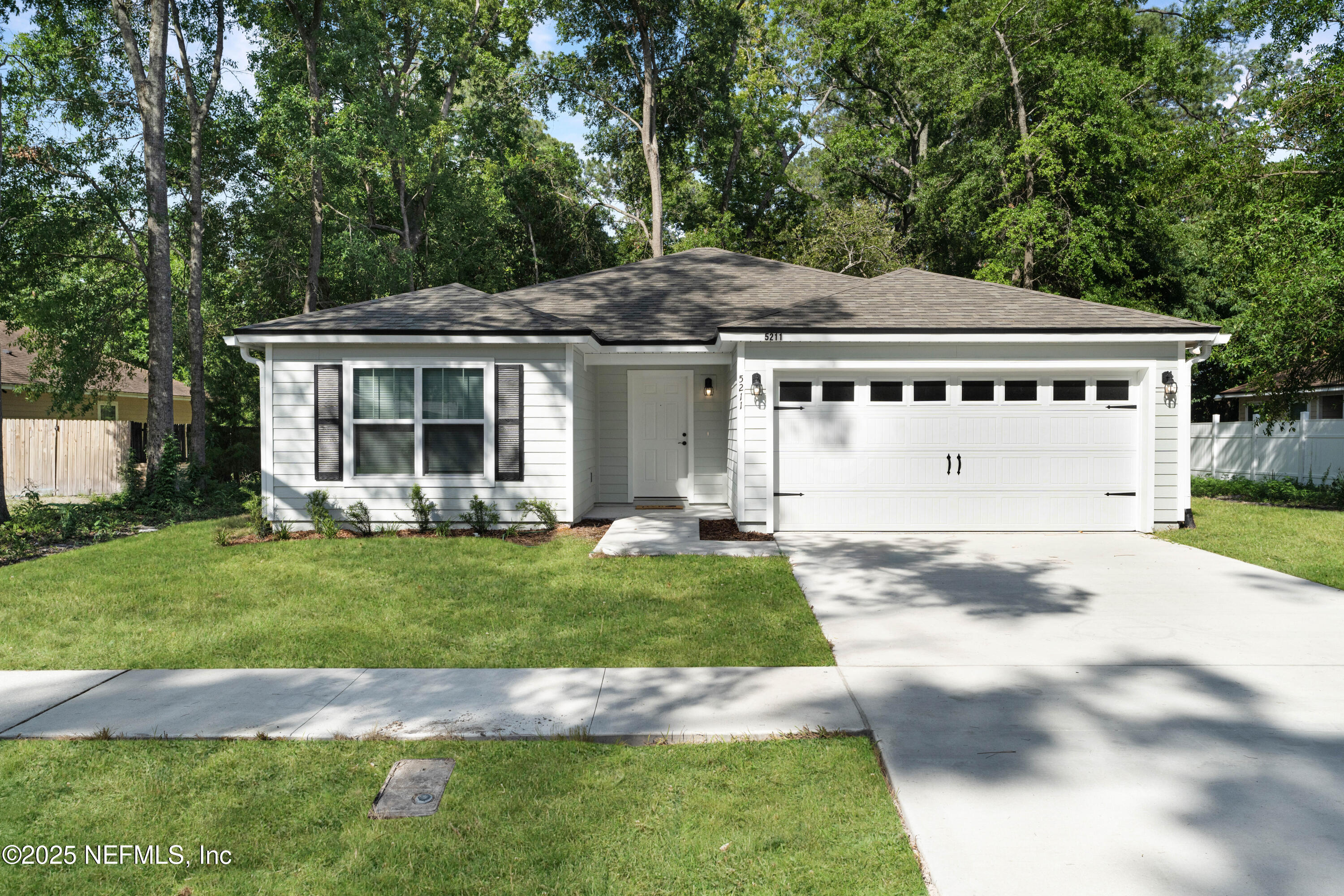 5211 Vernon Road Jacksonville, FL 32209 - Photo 2 of 27 a front view of a house with a yard