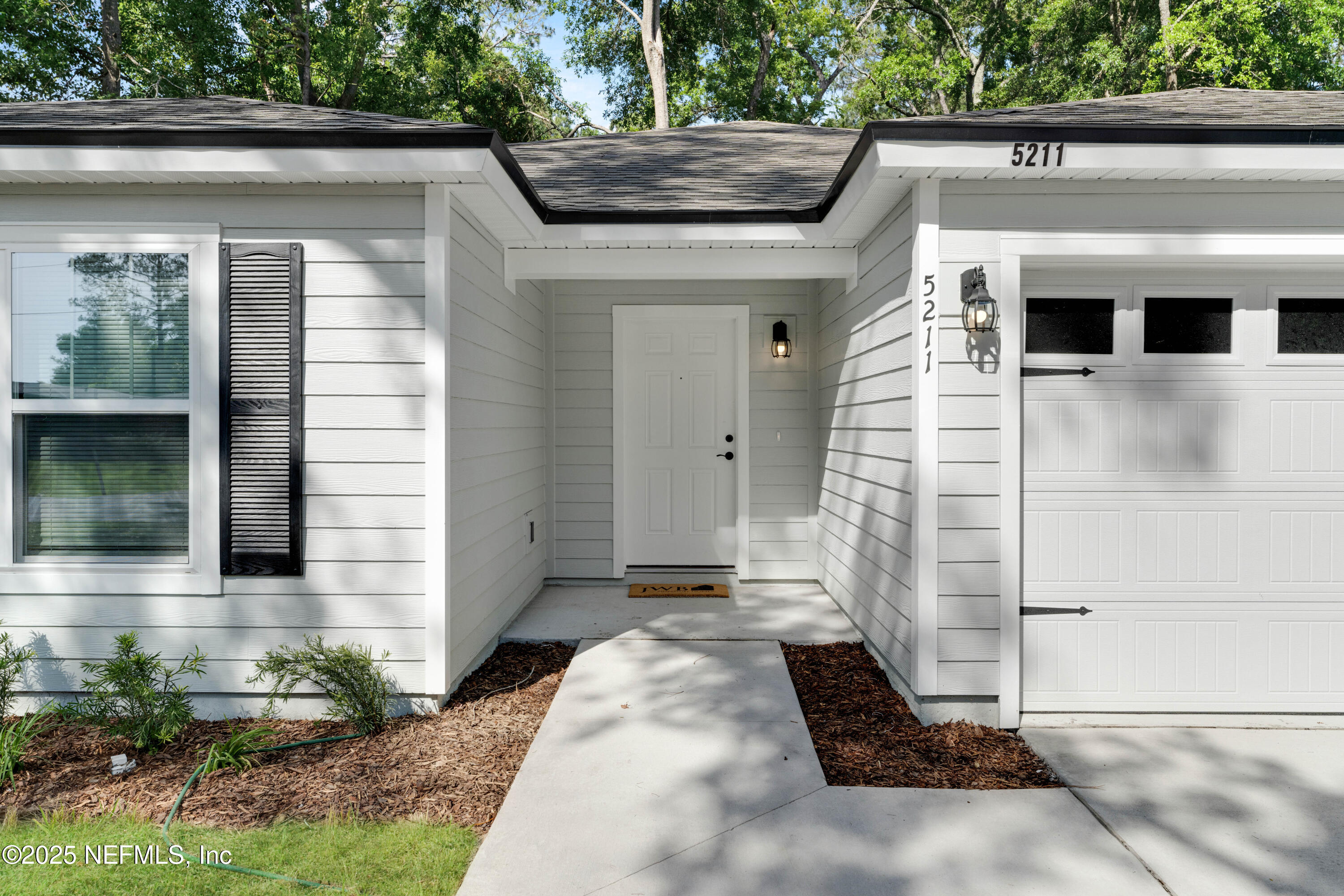 5211 Vernon Road Jacksonville, FL 32209 - Photo 3 of 27 a front view of a house with a yard
