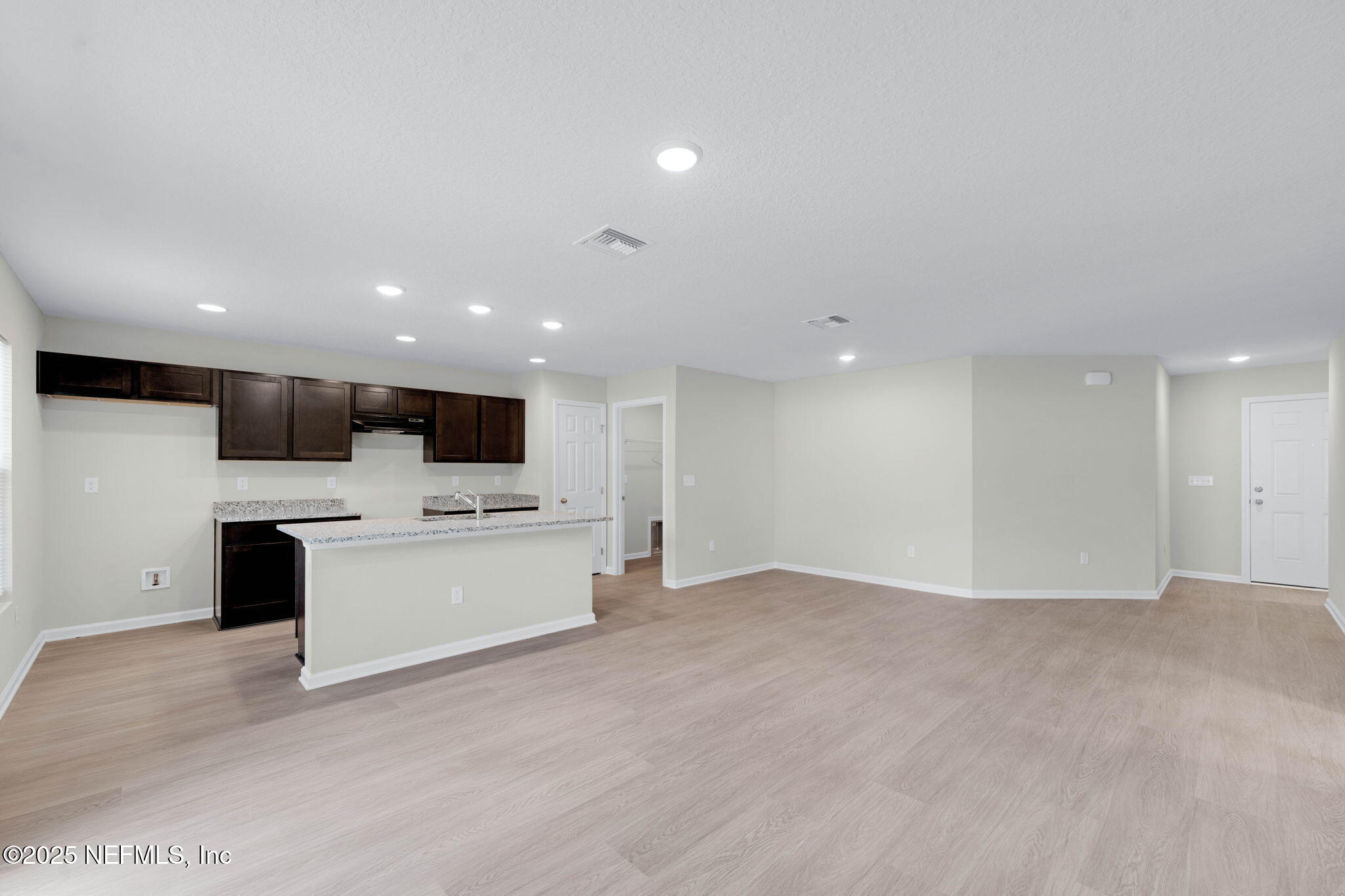 5211 Vernon Road Jacksonville, FL 32209 - Photo 8 of 27 a view of kitchen with stainless steel appliances kitchen island microwave and stove