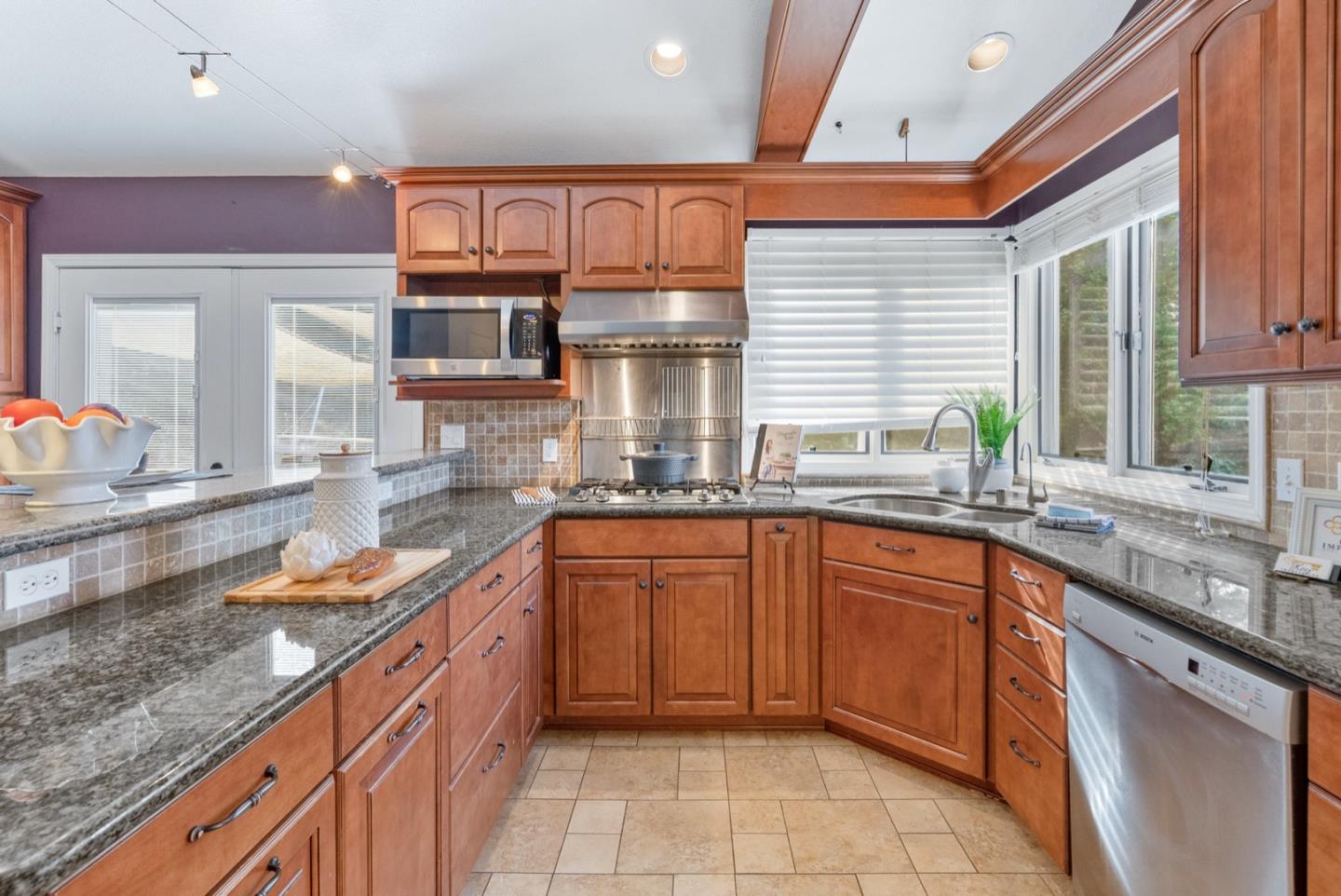 720 Fern Ridge Felton, CA 95018 - Photo 14 of 47 a kitchen with stainless steel appliances granite countertop a sink stove and cabinets