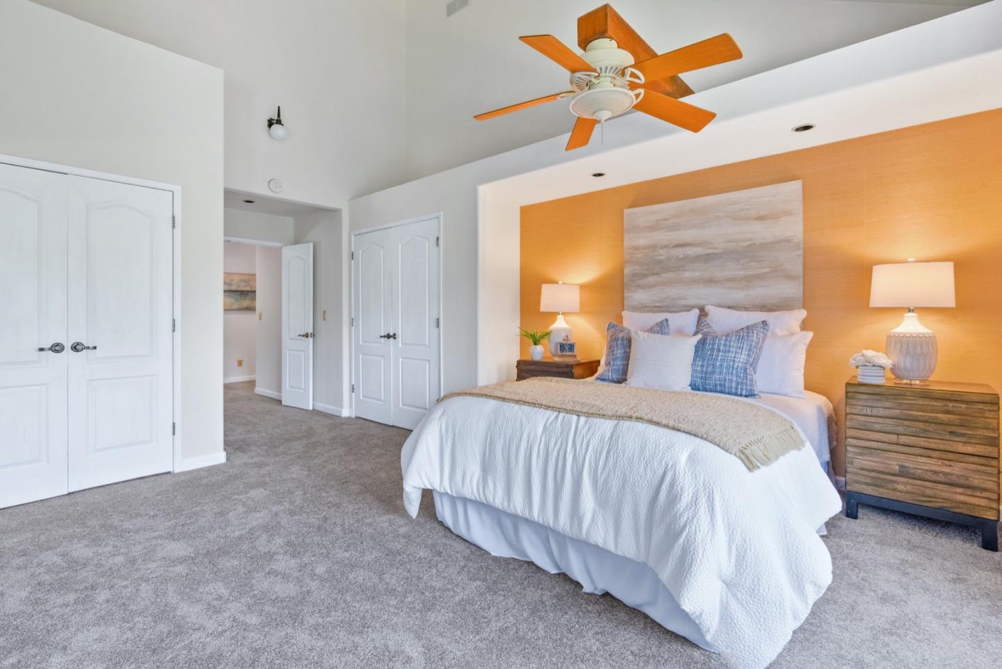 720 Fern Ridge Felton, CA 95018 - Photo 23 of 47 a spacious bedroom with a bed and a chandelier