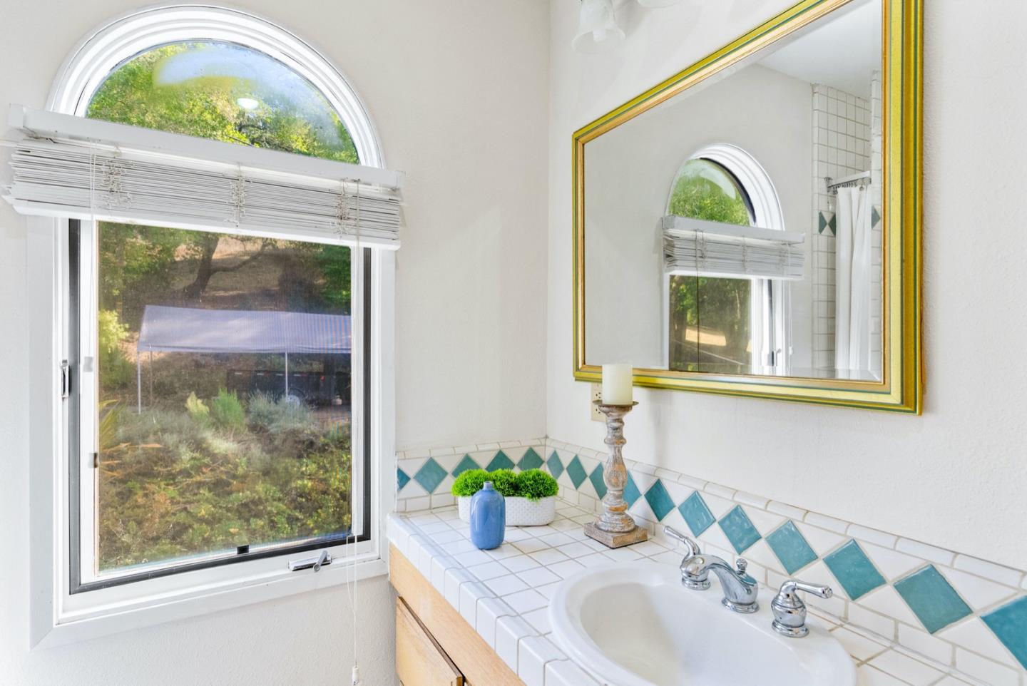 720 Fern Ridge Felton, CA 95018 - Photo 37 of 47 a bathroom with a sink and a mirror