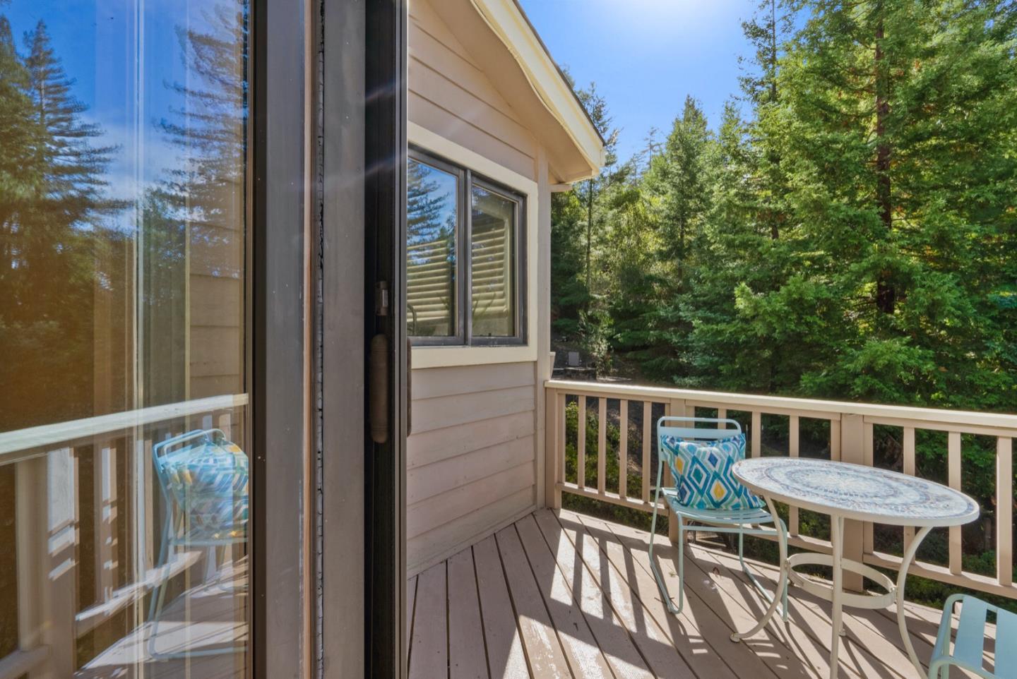 720 Fern Ridge Felton, CA 95018 - Photo 39 of 47 a view of a patio with table and chairs and wooden floor