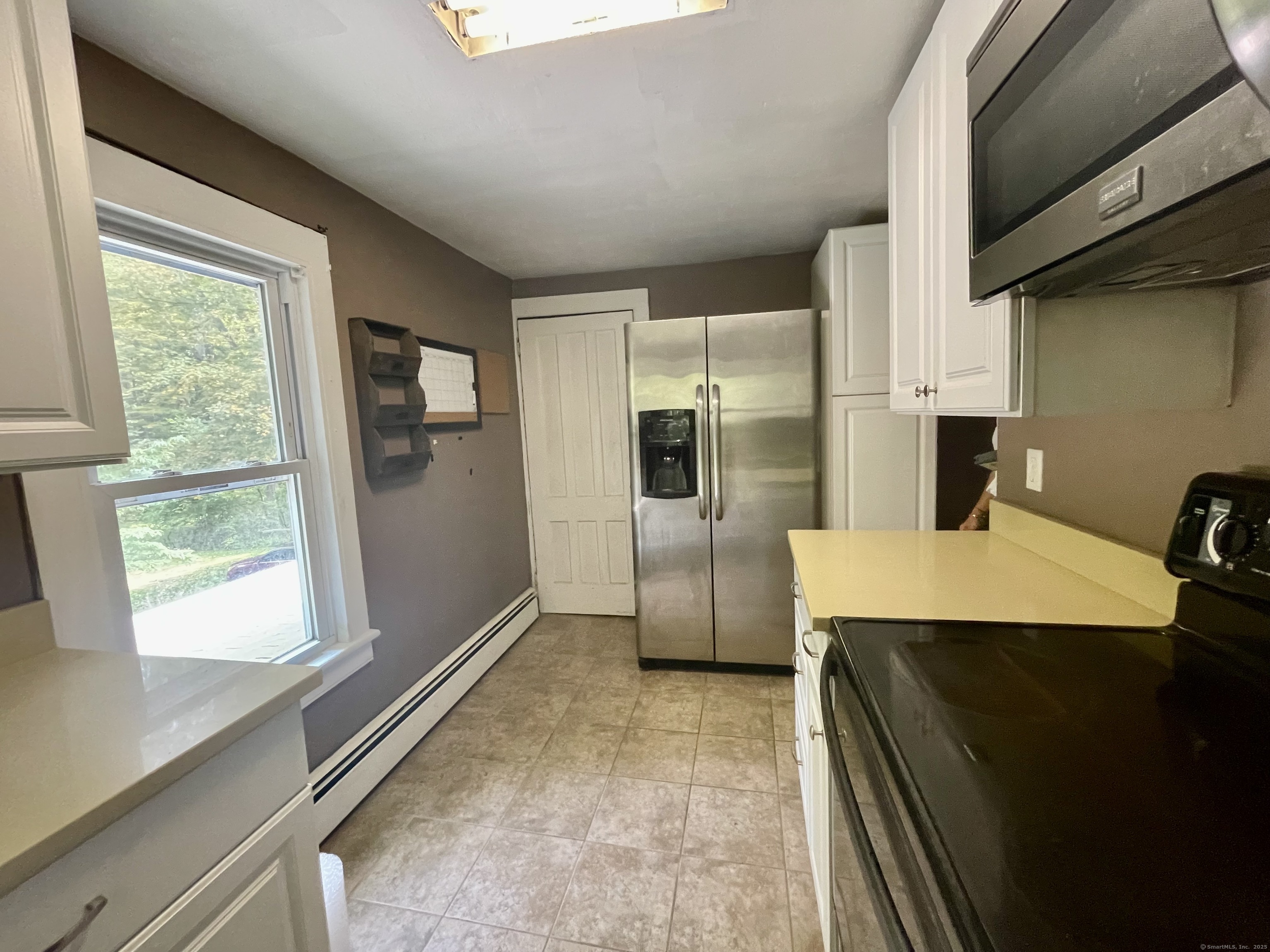 66 Portland Avenue Redding, CT 06896 - Photo 18 of 24 View of the door to the spacious walk up Attic and small eating area in Kitchen