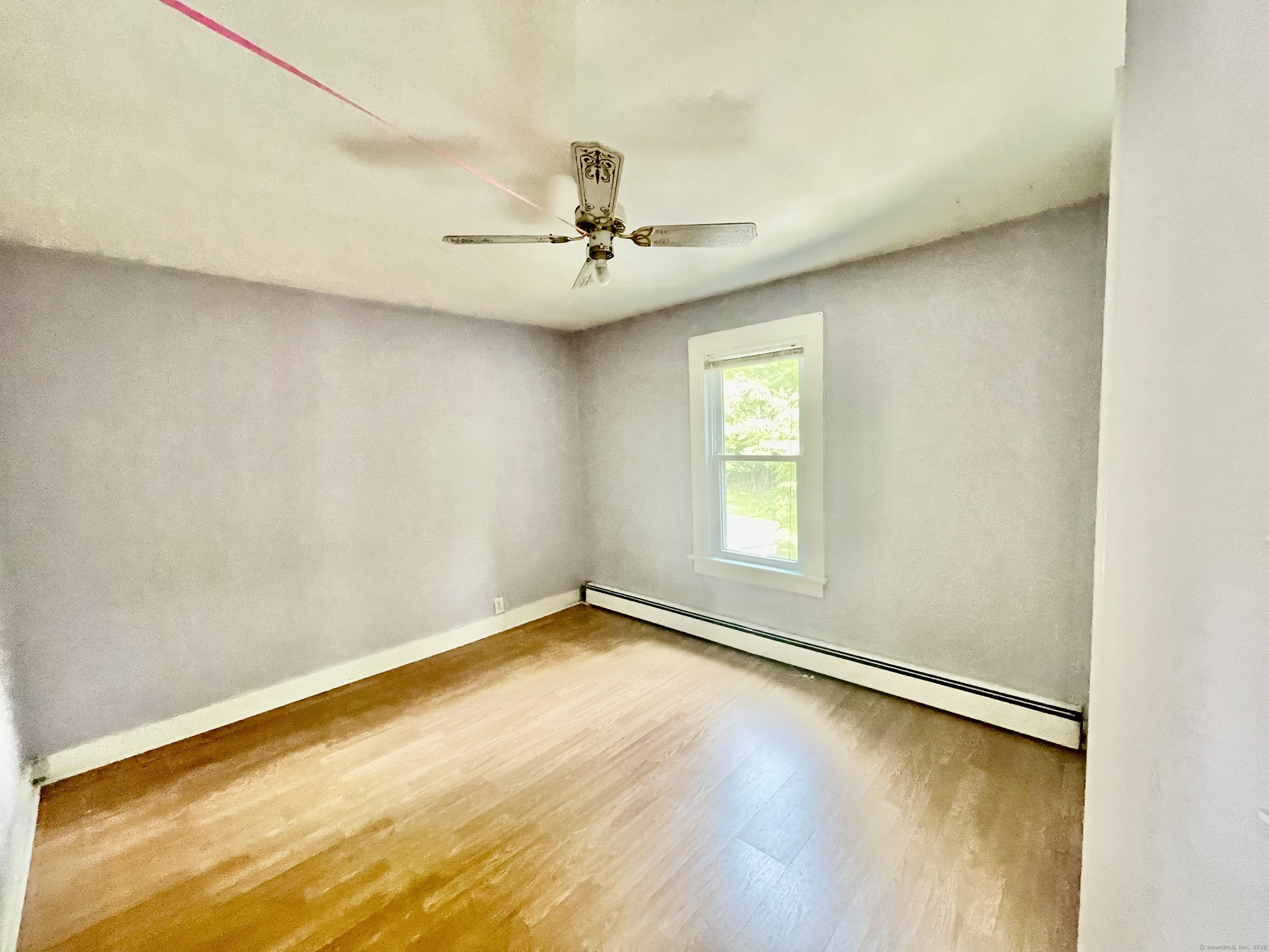 66 Portland Avenue Redding, CT 06896 - Photo 20 of 24 Bedroom One with ceiling fan and newer laminate flooring