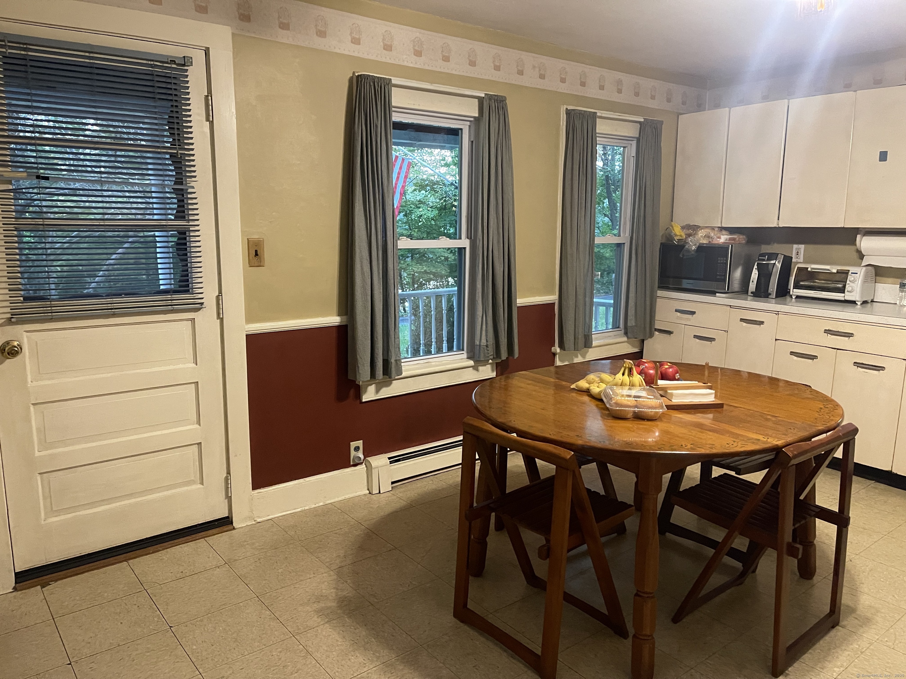 66 Portland Avenue Redding, CT 06896 - Photo 10 of 24 Main level eat-in Kitchen with door to large front porch with water view