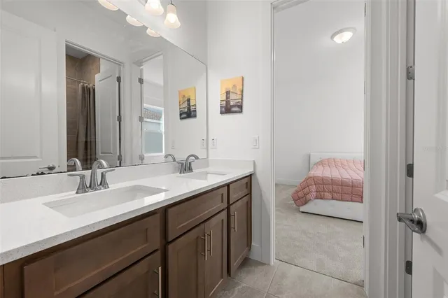 a bathroom with a double vanity sink and mirror