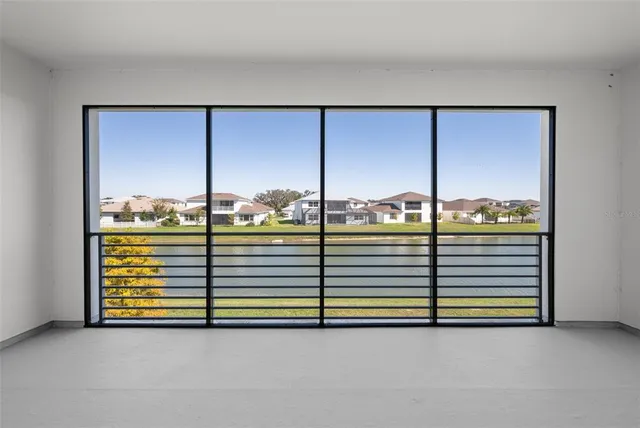 a spacious bedroom with a bed and a window