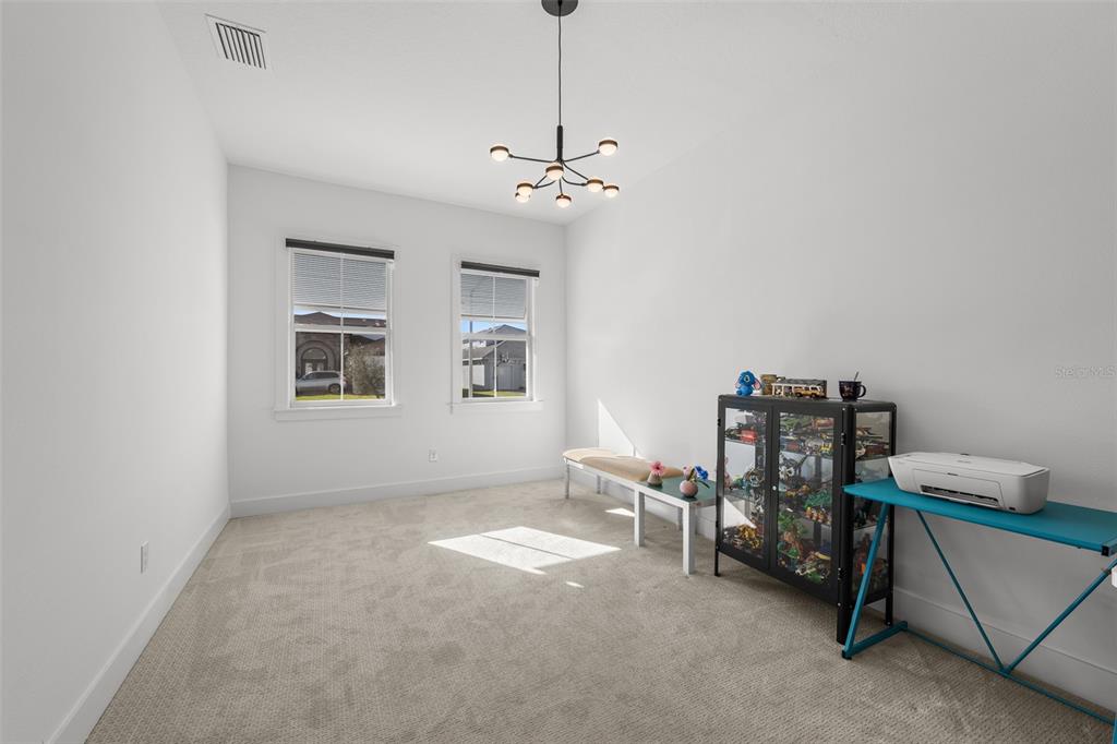 9185 Sanders Tree Loop Wesley Chapel, FL 33545 - Photo 33 of 48 a view of workspace with furniture and windows