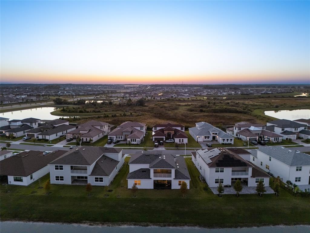 9185 Sanders Tree Loop Wesley Chapel, FL 33545 - Photo 40 of 48 an aerial view of a house with a big yard