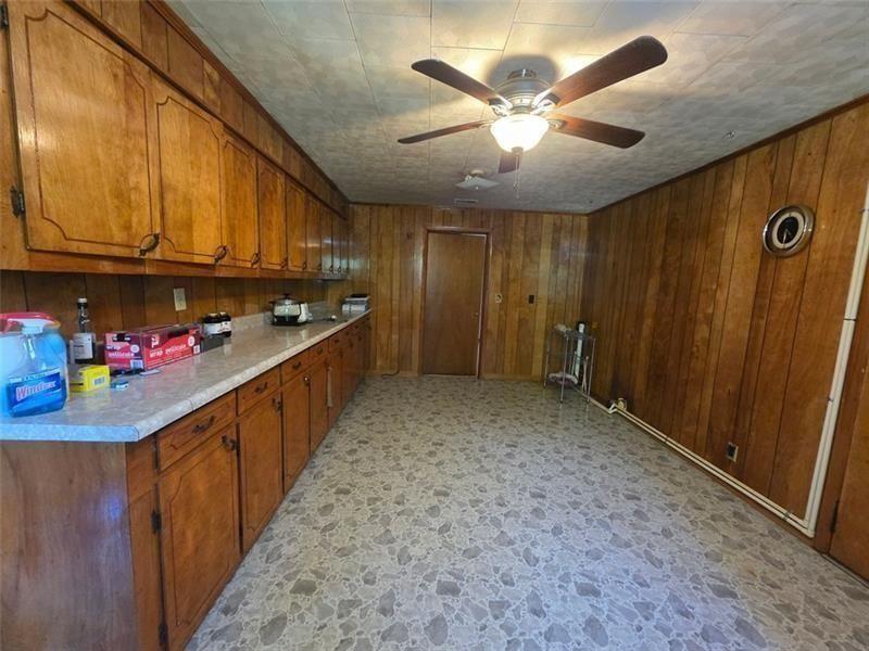 3834 Highway 124 Jefferson, GA 30549 - Photo 11 of 12 a kitchen with stainless steel appliances granite countertop lots of counter top space and cabinets