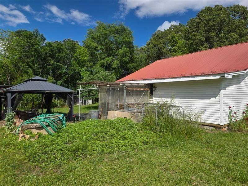 3834 Highway 124 Jefferson, GA 30549 - Photo 12 of 12 a view of a house with a yard and sitting area