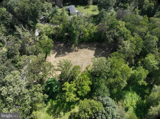 an aerial view of residential house with outdoor space