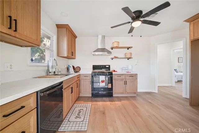 a kitchen with a stove oven and sink
