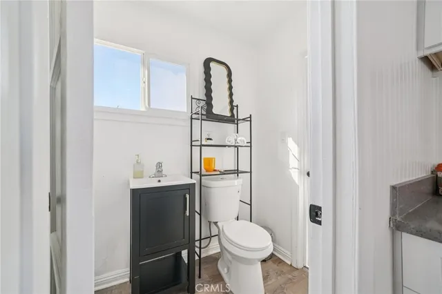 a bathroom with a sink toilet and vanity