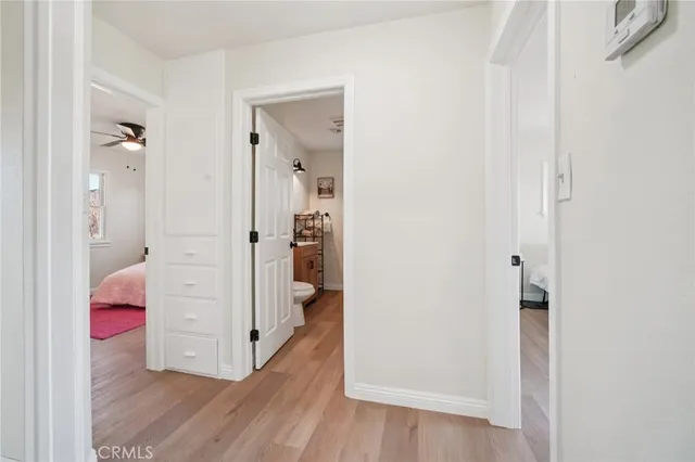 wooden floor with white walls