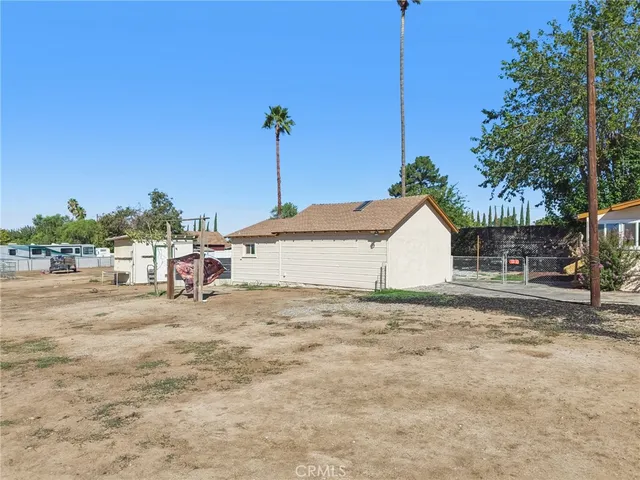 a view of a house with a outdoor space and sitting area