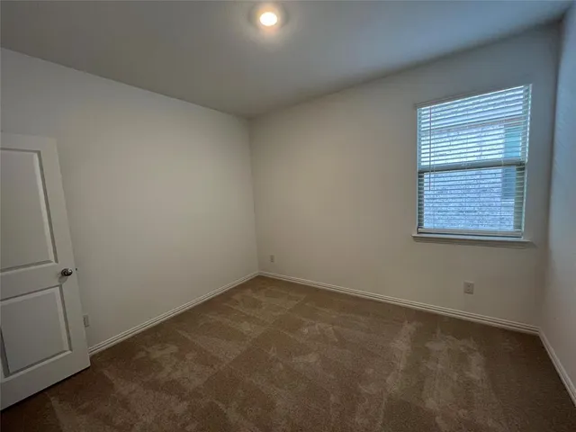 a view of gallery with wooden floor