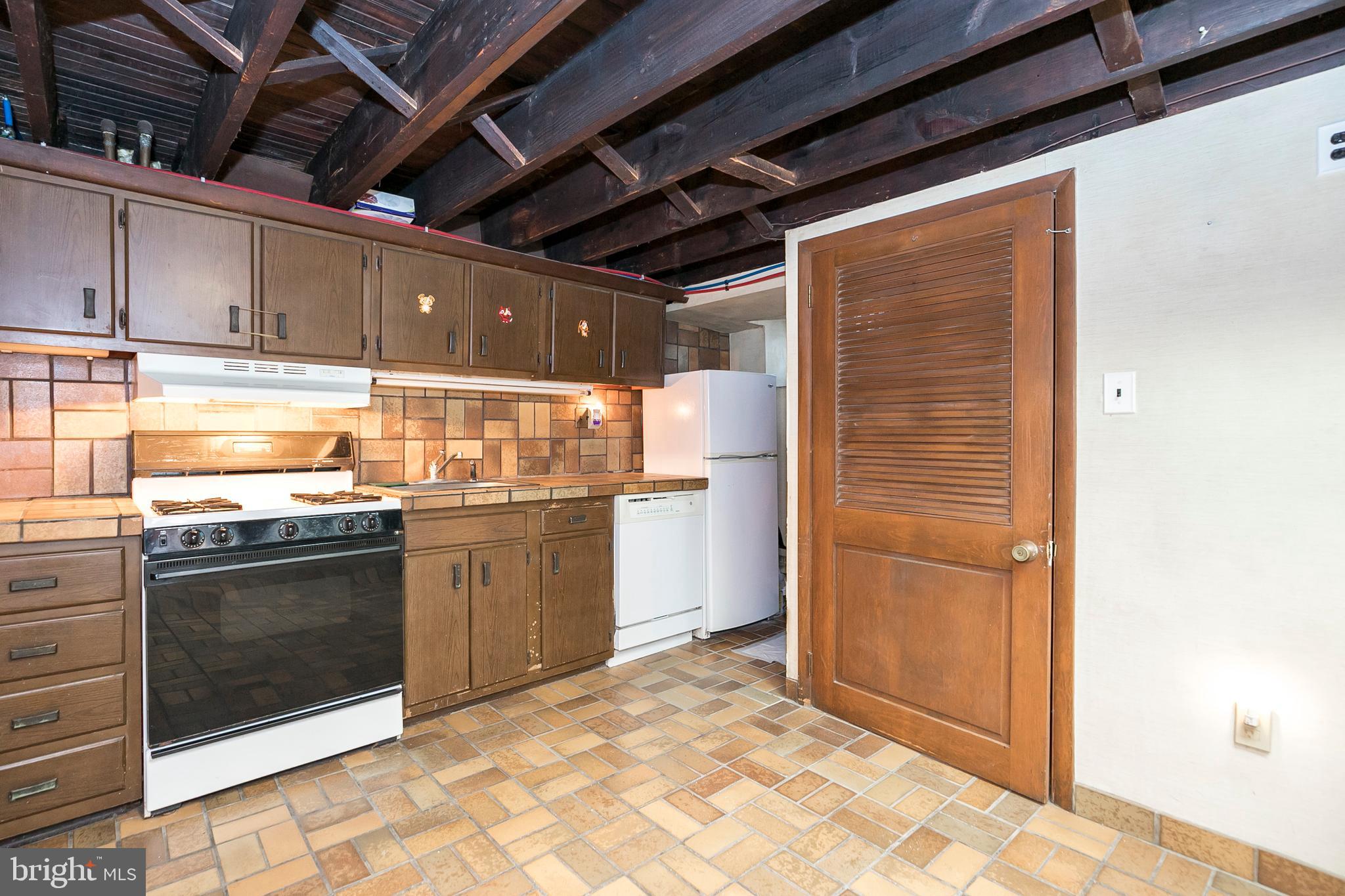 131 Walsh Road Lansdowne, PA 19050 - Photo 26 of 39 Basement Kitchen with Gas Range