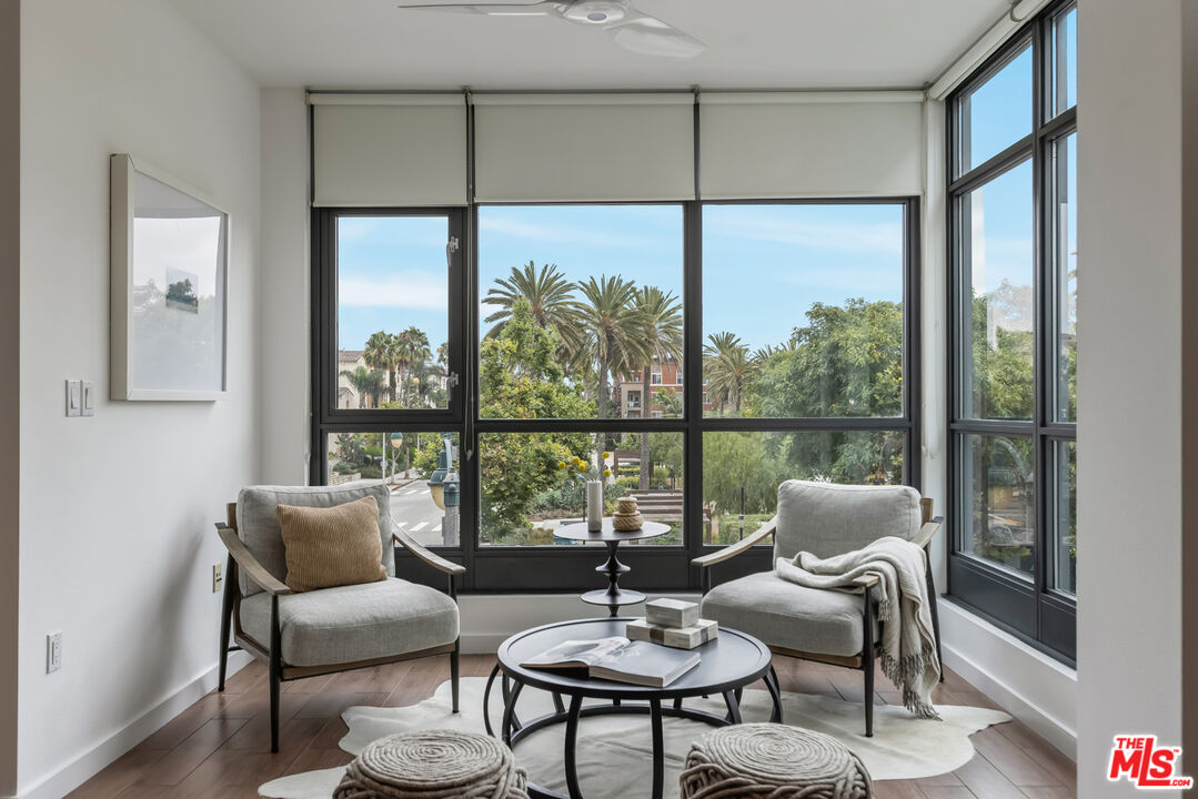 13045 Pacific Promenade, Unit 330 Los Angeles, CA 90094 - Photo 14 of 43 a living room with furniture city view and large windows